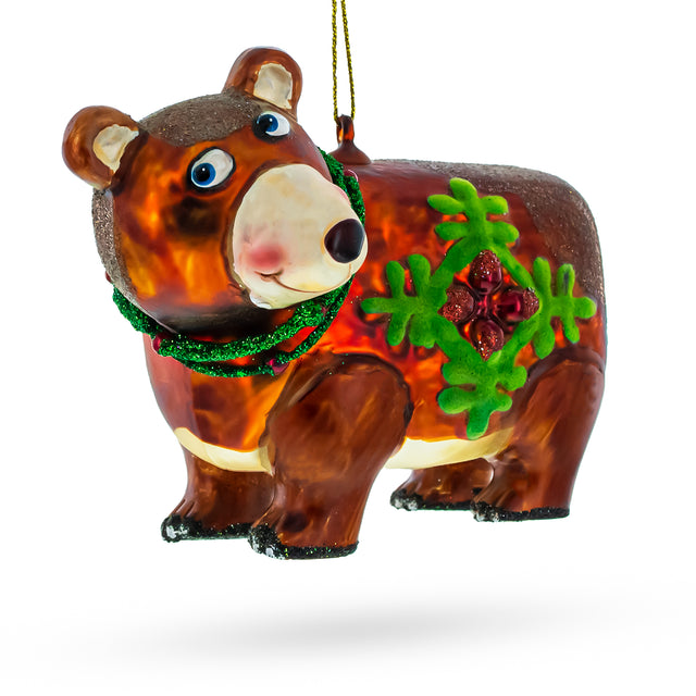 Glass Festive Brown Bear Holding a Poinsettia - Blown Glass Christmas Ornament in Brown color