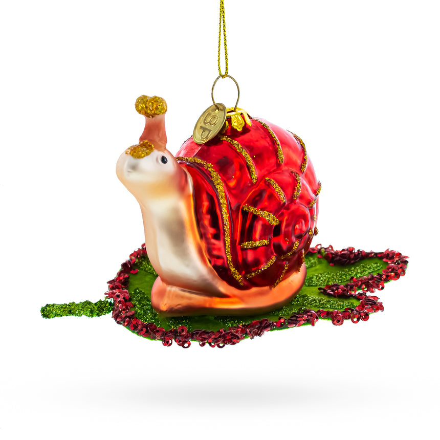 Snail Perched on a Green Leaf Blown Glass Christmas Ornament in  color