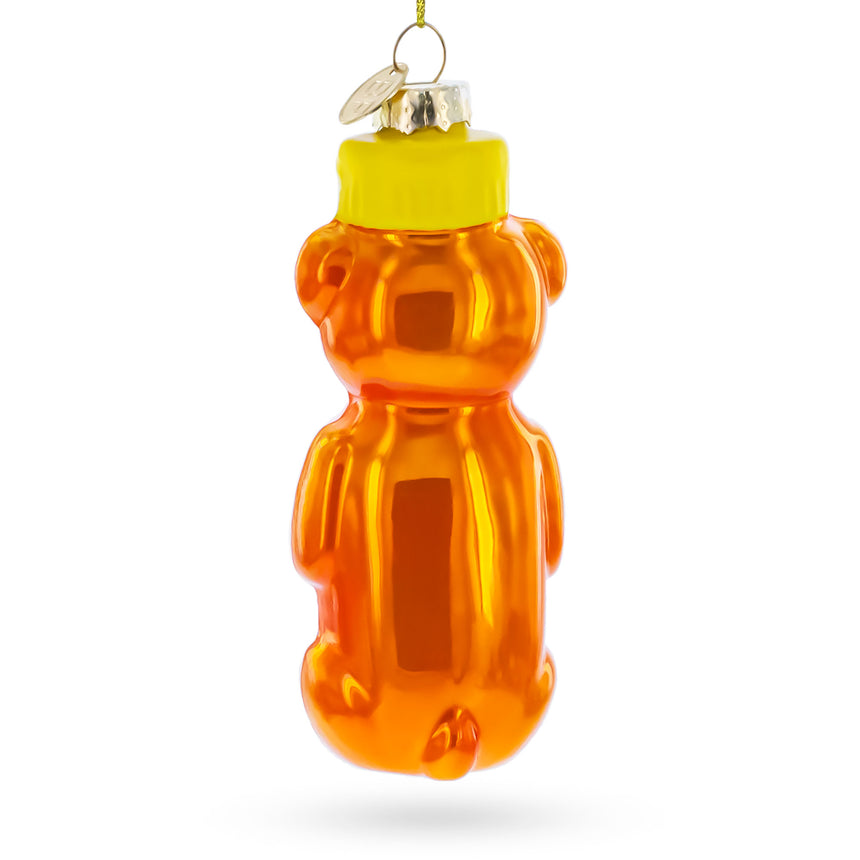 Honey Bear Bottle Blown Glass Christmas Ornament , dimensions in inches: 4.9 x 1.7 x 1.8
