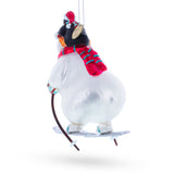 Skiing Polar Bear with Penguin Blown Glass Christmas Ornament , dimensions in inches: 4.9 x 2.2 x 3.1