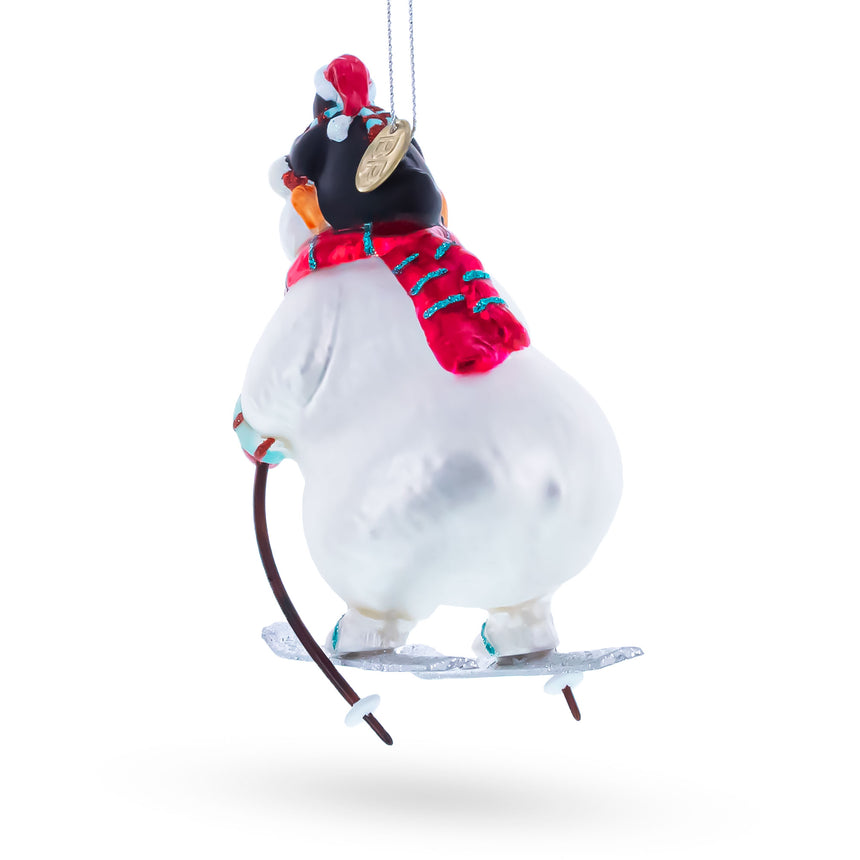 Skiing Polar Bear with Penguin Blown Glass Christmas Ornament , dimensions in inches: 4.9 x 2.2 x 3.1