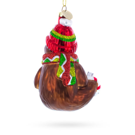 Festive Sloth with Mug Blown Glass Christmas Ornament , dimensions in inches: 4.7 x 3 x 2.6