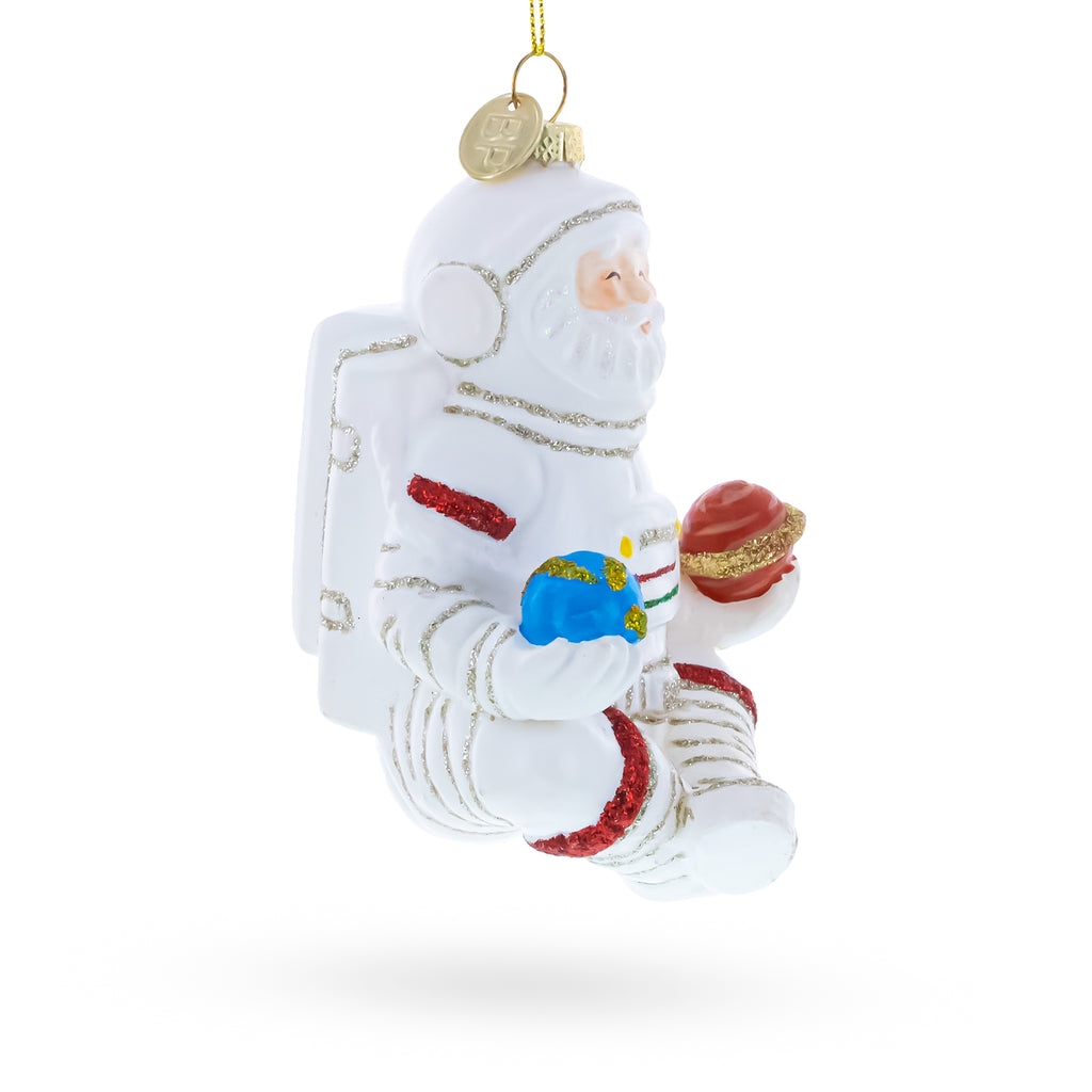 Santa Astronaut Blown Glass Christmas OrnamentChina , dimensions in inches: 4.7 x 3.3 x 3