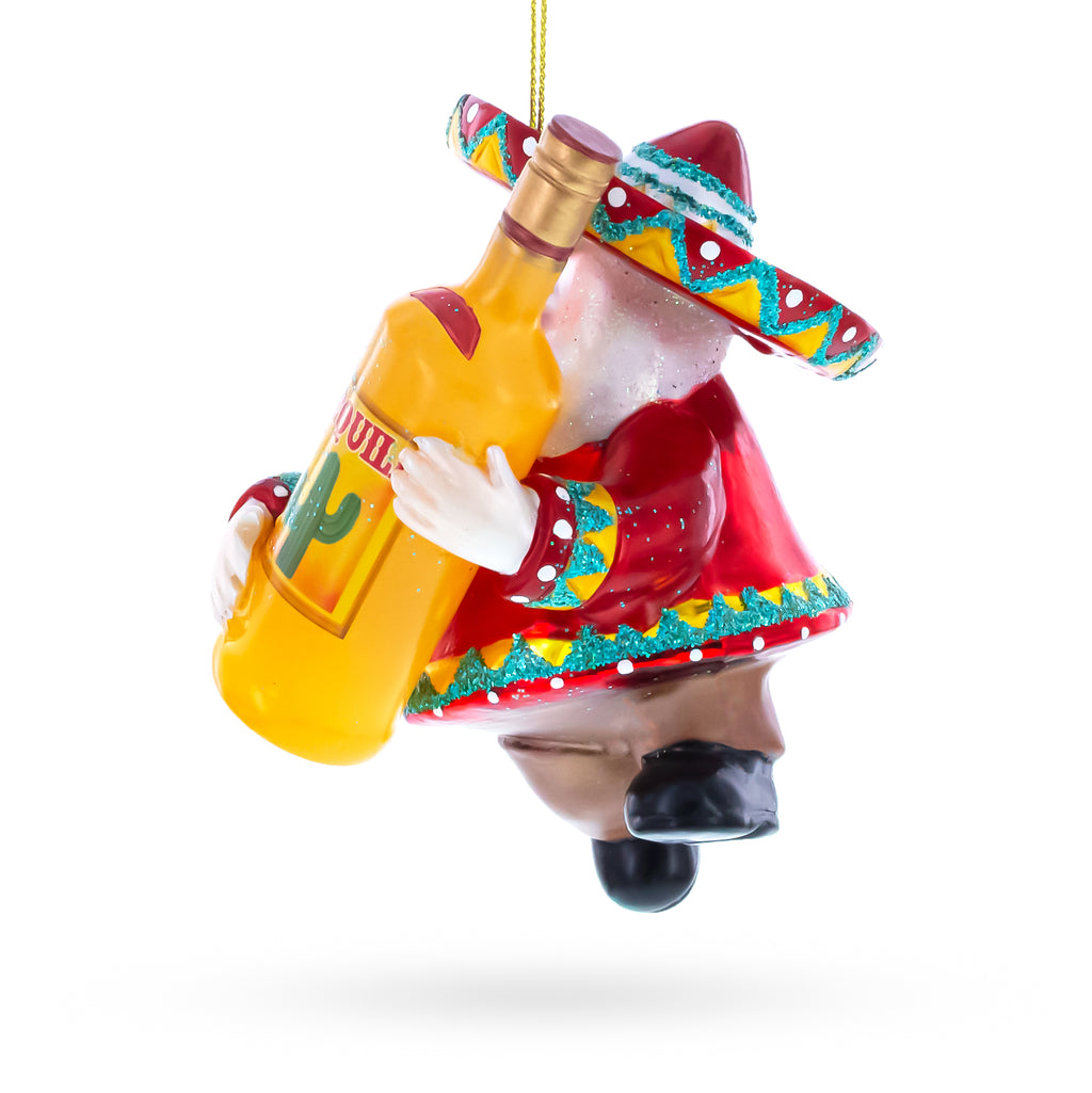 Mexican Santa with Tequila Bottle Glass Christmas OrnamentChina , dimensions in inches: 4.3 x 2.6 x 3.4