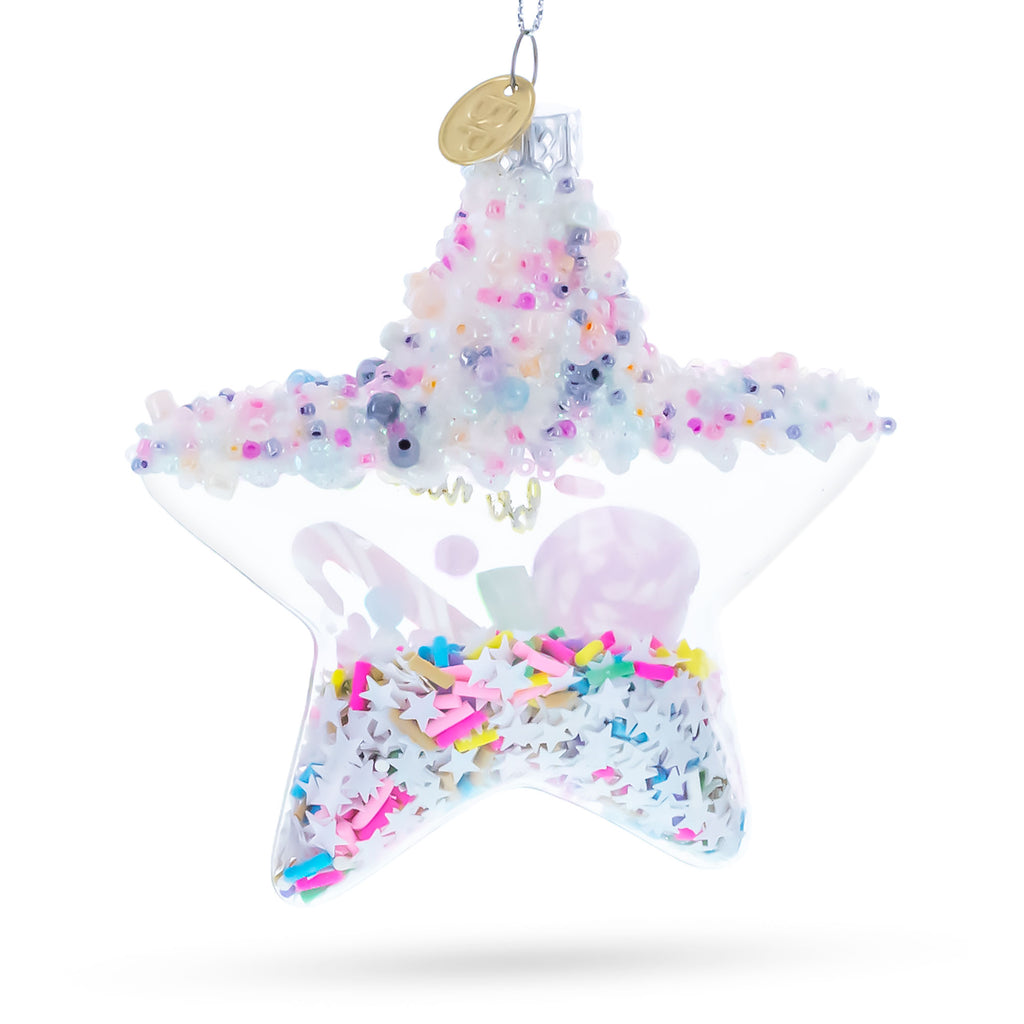 Sugar Star with Shakable Sprinkles Blown Glass Christmas OrnamentChina , dimensions in inches: 4.4 x 1.5 x 4