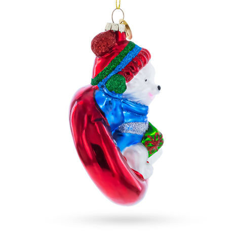 Puppy on Snow Tube Blown Glass Christmas OrnamentChina , dimensions in inches: 4.9 x 2.2 x 3.3