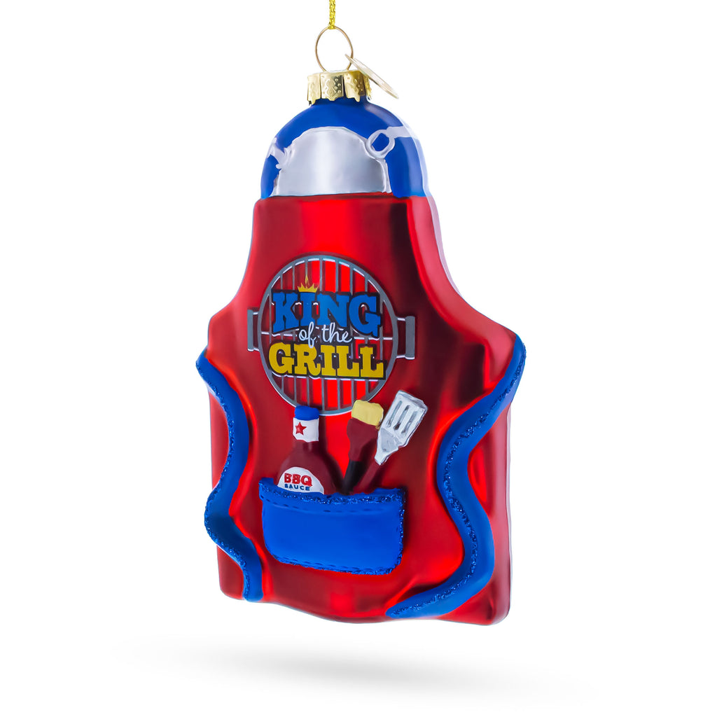 BBQ King of the Grill Apron Glass Christmas OrnamentChina , dimensions in inches: 5 x 1 x 2.9