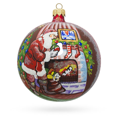 Santa Filling Stockings by a Cozy Fireplace Blown Glass Ball Christmas Ornament 4 Inches in Red color, Round shape