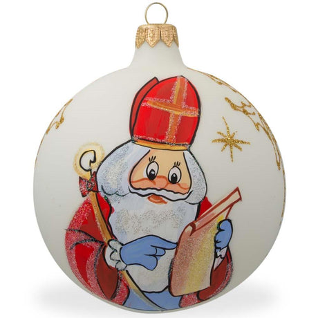 St. Nicholas Reviewing His Gift List in Winter White Blown Glass Ball Christmas Ornament 4 Inches in White color, Round shape