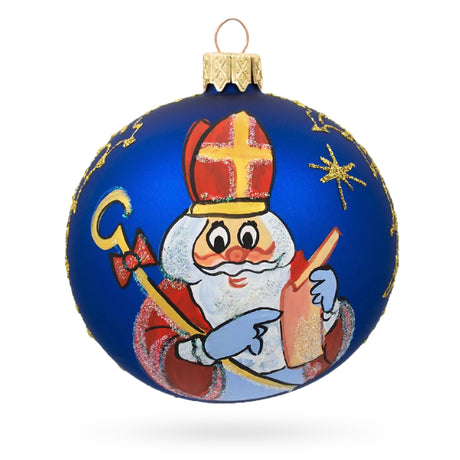 St. Nicholas Reviewing His Gift List in Winter White Blown Glass Ball Christmas Ornament 3.25 Inches in Blue color, Round shape