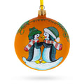 Our First Christmas Penguin Couple Glass Ball Ornament 4 Inches in Orange color Round