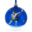 Ice Rink Warrior: Hockey Player in Action on Blue Blown Glass Ball Christmas Sports Ornament 4 Inches in Blue color, Round shape