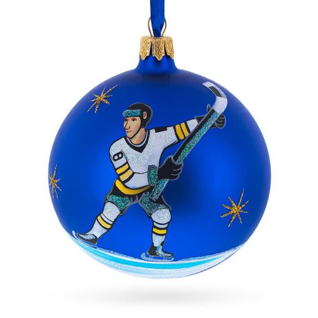 Hockey Player in Action on Blue Blown Glass Ball Christmas Sports Ornament 4 Inches in Blue color Round