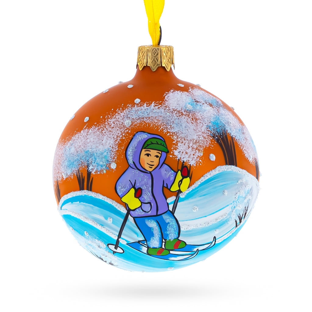 Glass Adventurous Boy Skiing - Blown Glass Ball Christmas Ornament 3.25 Inches in Orange color Round