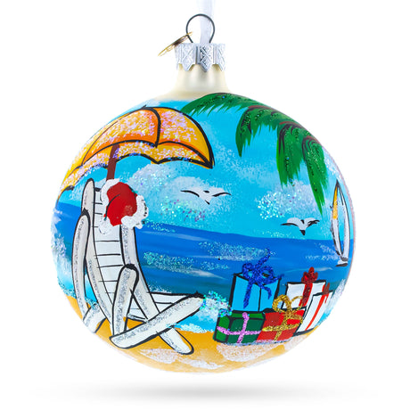 Santa Hat Relaxing at Beach Blown Glass Ball Christmas Ornament 4 Inches in Multi color, Round shape