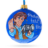 Capturing Memories: Photographer Holding Camera - Blown Glass Christmas Ornament 3.25 Inches in Blue color, Round shape