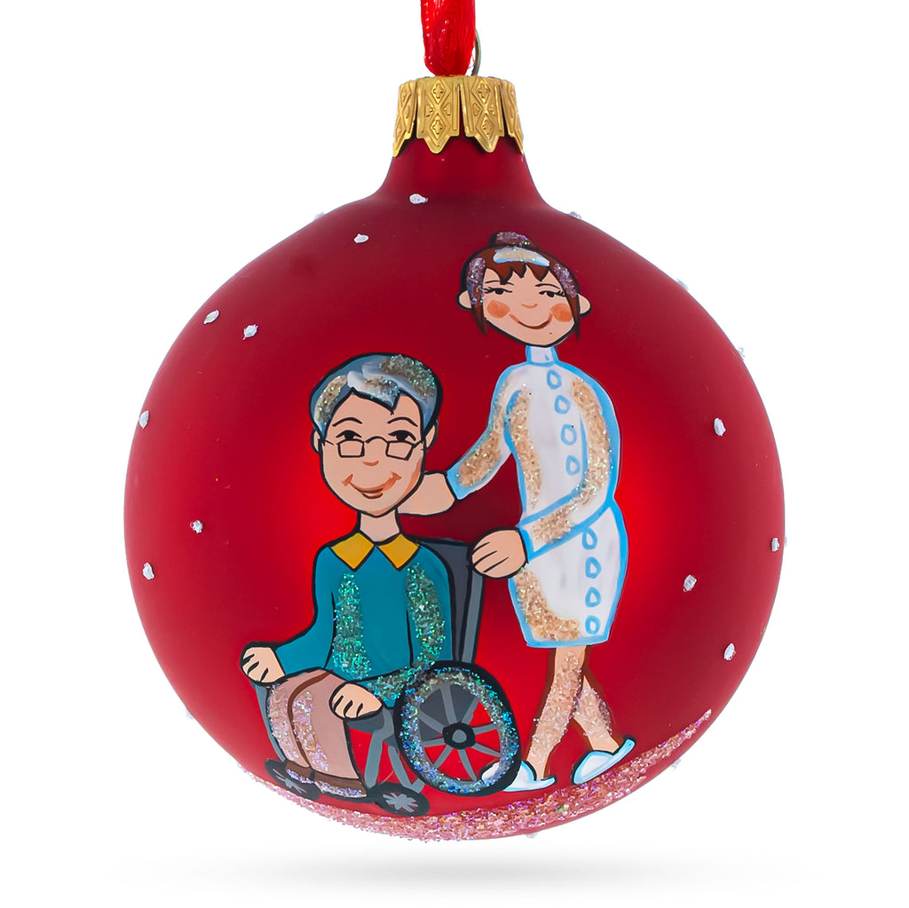 Glass Compassionate Caregiver with Woman in Wheelchair - Blown Glass Ball Christmas Ornament 3.25 Inches in Red color Round