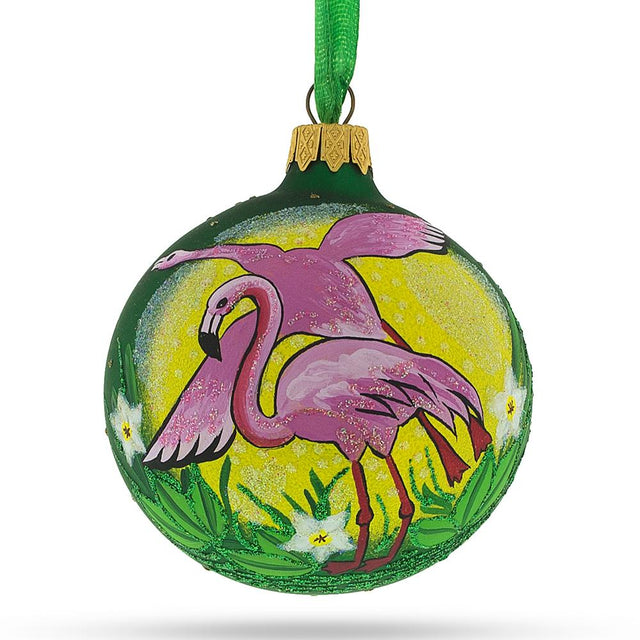 Vibrant Pink Flamingos Blown Glass Christmas Ornament 3.25 Inches in Green color, Round shape