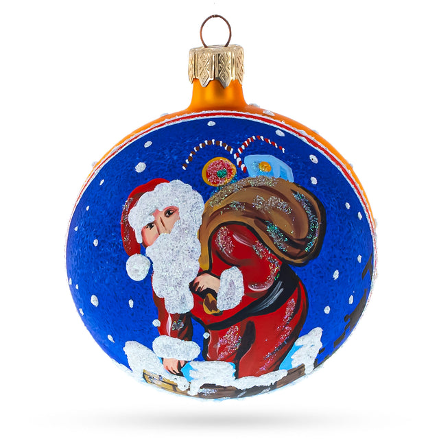 Cheerful Santa Climbing Down the Chimney Blown Glass Ball Christmas Ornament 3.25 Inches in Blue color, Round shape