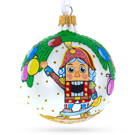 Nutcracker and Christmas Tree Blown Glass Ball Ornament 3.25 Inches in Multi color Round