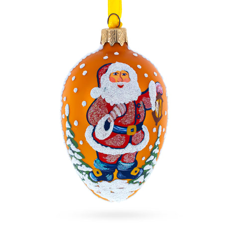Santa With Lantern Glass Christmas Ornament 4 Inches in Gold color Oval