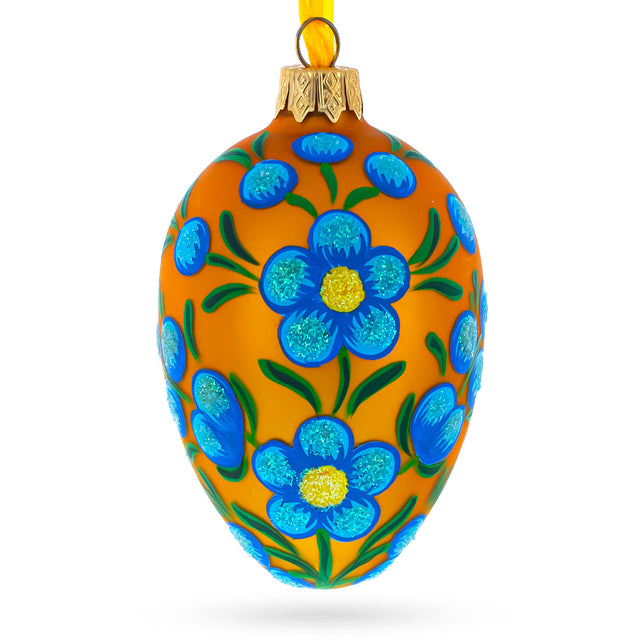 Blue Flowers on Orange Glass Egg Ornament 4 Inches in Gold color, Oval shape