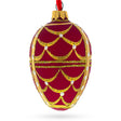 Gold Arches On Red Egg Glass Ornament 4 Inches in Red color, Oval shape
