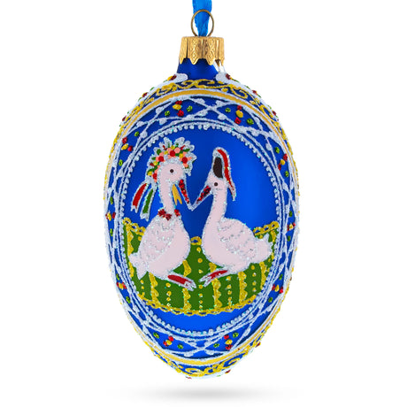 Storks Family Glass Egg Ornament 4 Inches in Blue color, Oval shape
