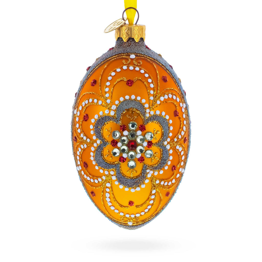 White Flower On Orange Glass Egg Ornament 4 Inches in Gold color Oval
