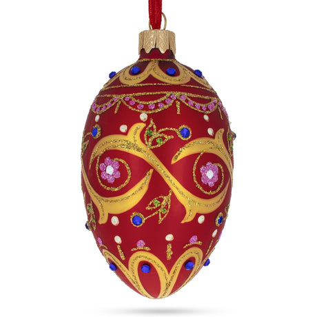 Blue Jewels On Red Glass Egg Ornament 4 Inches in Red color, Oval shape