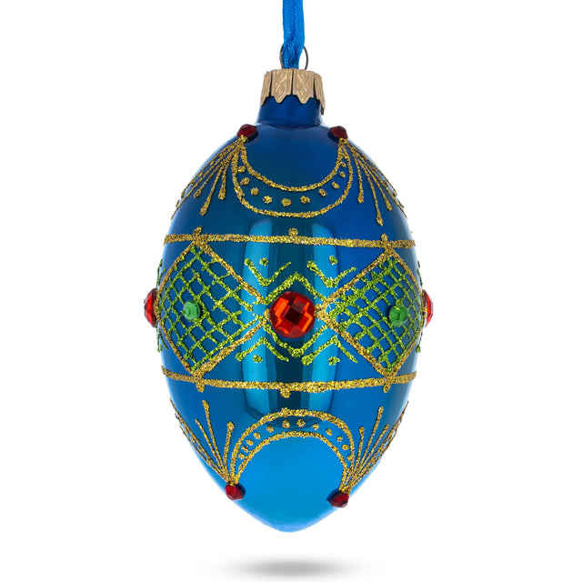 Jeweled Red Ruby on Blue Glass Egg Ornament 4 Inches in Blue color, Oval shape