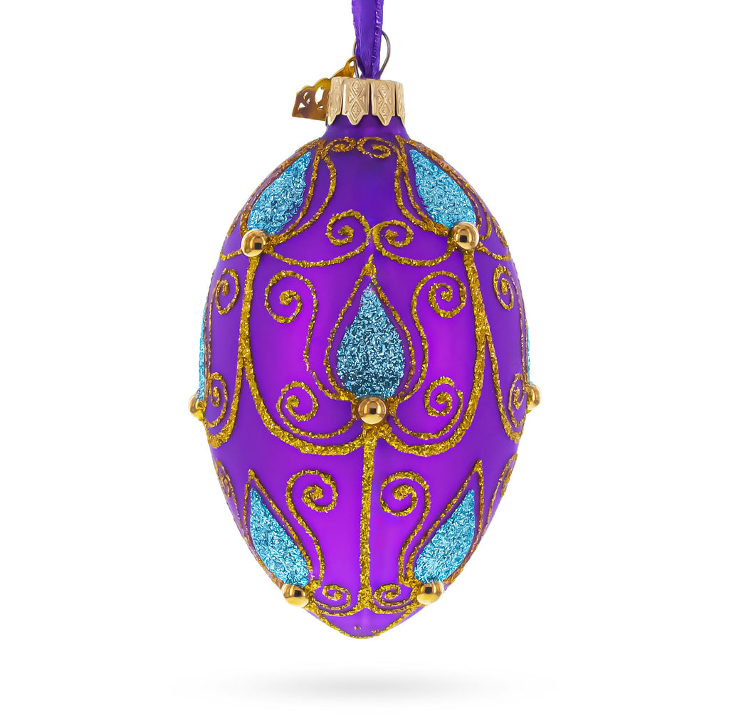 Blue Leaf on Purple Glass Egg Ornament 4 Inches in Purple color Oval