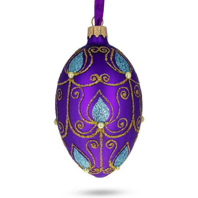 Blue Leaf on Purple Glass Egg Ornament 4 Inches in Purple color, Oval shape