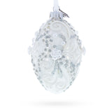 Silver Glitter Scrolls, Pearls & Rose Accents Winter Elegance Glass Egg Ornament 4 Inches in White color Oval