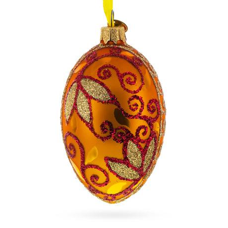Glass Autumn Leaves on Gold Glass Egg Christmas Ornament 4 Inches in Orange color Oval