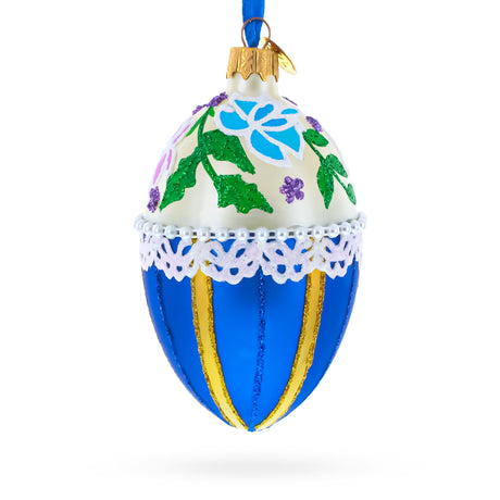 Flowers on Beige and Blue Glass Egg Christmas Ornament 4 Inches in Blue color Oval
