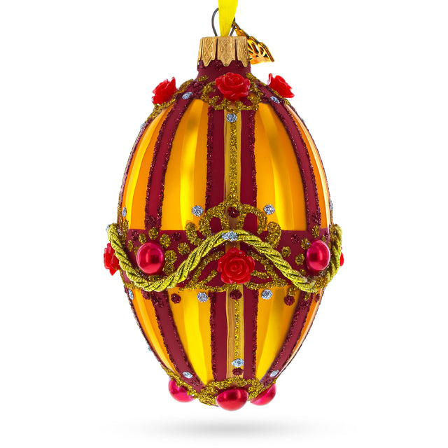 Glass Golden Stripes over Pearls and Roses Glass Egg Christmas Ornament 4 Inches in Orange color Oval