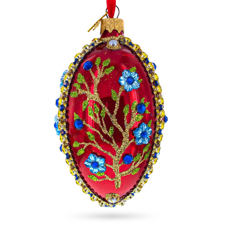 Glass Blue Bejeweled Flowers on Red Glass Egg Ornament 4 Inches in Red color Oval