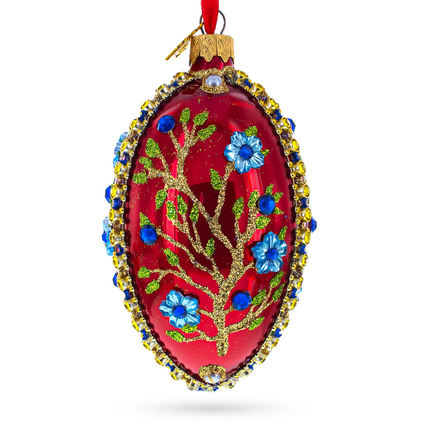 Blue Bejeweled Flowers on Red Glass Egg Ornament 4 Inches in Red color Oval