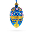 Flowers on Glossy Blue Glass Egg Christmas Ornament 4 Inches in Blue color Oval