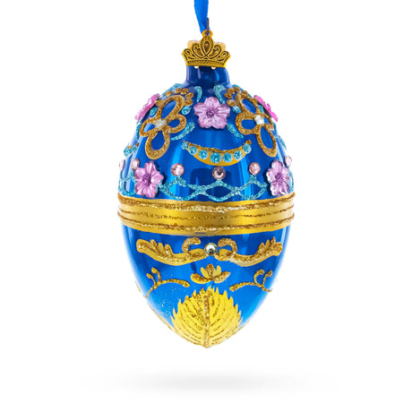 Flowers on Glossy Blue Glass Egg Christmas Ornament 4 Inches in Blue color Oval
