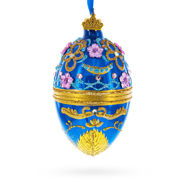 Flowers on Glossy Blue Glass Egg Christmas Ornament 4 Inches in Blue color Oval