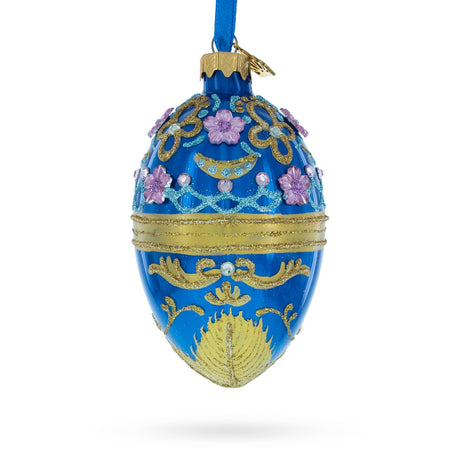 Flowers on Glossy Blue Glass Egg Christmas Ornament 4 Inches in Blue color, Oval shape