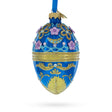 Glass Flowers on Glossy Blue Glass Egg Christmas Ornament 4 Inches in Blue color Oval