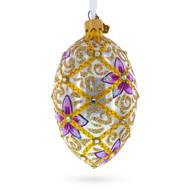 Glass Purple Flowers on Golden Scroll Glass Egg Christmas Ornament 4 Inches in White color Oval