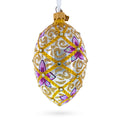 Purple Flowers on Golden Scroll Glass Egg Christmas Ornament 4 Inches in Gold color Oval