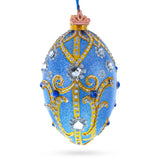 Jewels and Golden Scrolls on Glitter Blue Glass Egg Christmas Ornament 4 Inches in Blue color, Oval shape