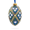 Glass White Flowers on Blue Glass Egg Ornament 4 Inches in Multi color Oval
