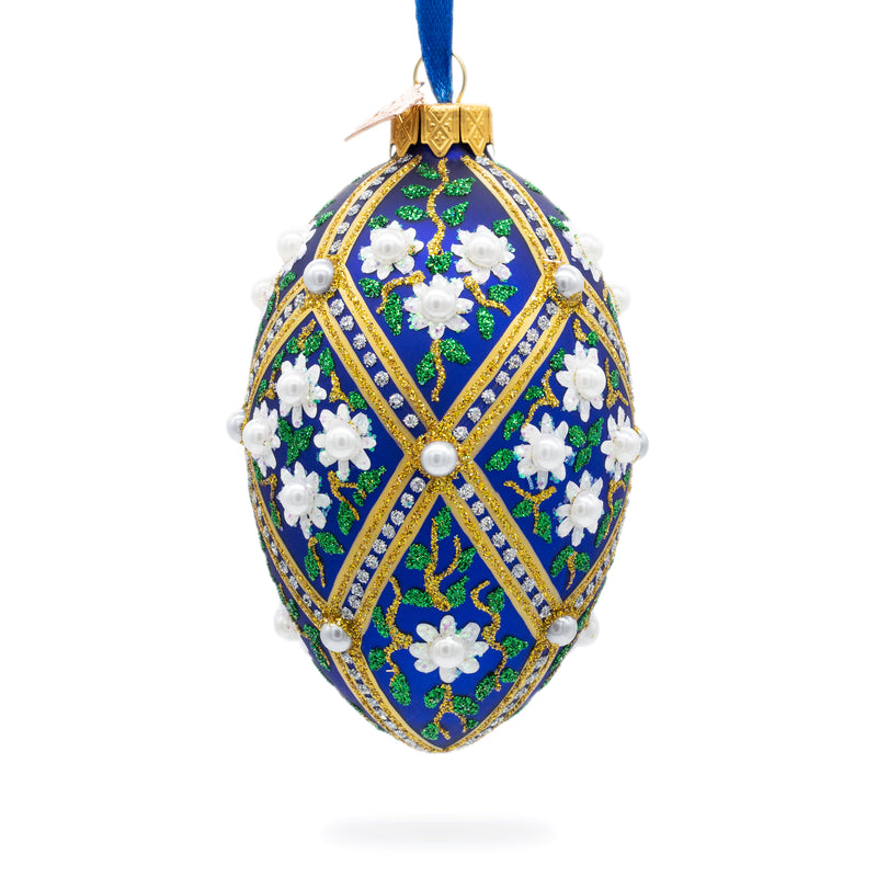 White Flowers on Blue Glass Egg Ornament 4 Inches in Multi color, Oval shape
