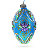 Glass Jeweled Purple Flowers on Blue Glass Egg Ornament 4 Inches in Blue color Oval